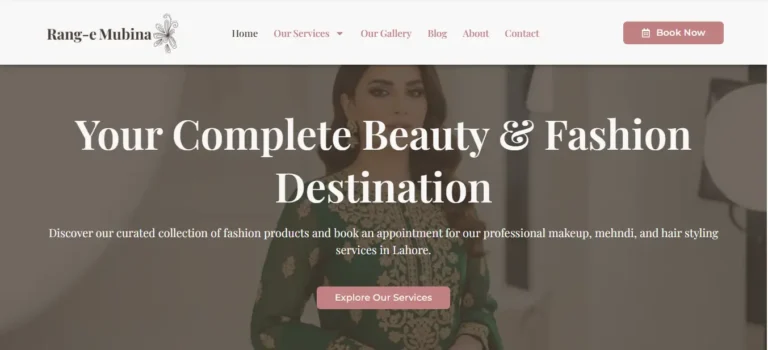 A high-resolution, professional mockup of the 'Rang e Mubina' fashion website. The website's elegant homepage (featuring soft pinks, high-fashion models, and makeup artistry) is displayed on a modern, sleek laptop screen. The laptop is set against a clean, softly blurred studio background that complements the brand's sophisticated style.