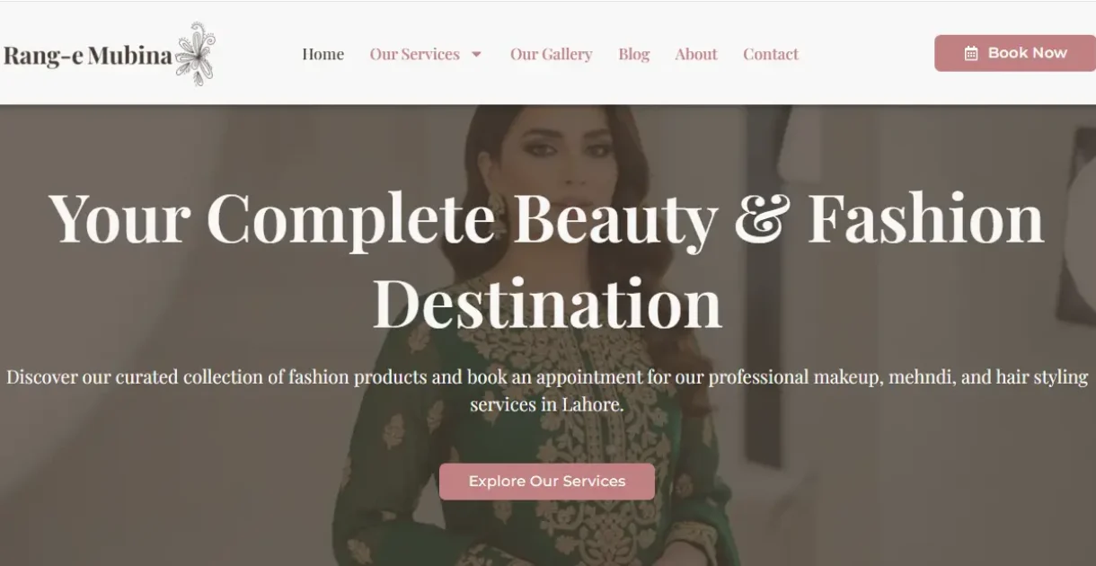 A high-resolution, professional mockup of the 'Rang e Mubina' fashion website. The website's elegant homepage (featuring soft pinks, high-fashion models, and makeup artistry) is displayed on a modern, sleek laptop screen. The laptop is set against a clean, softly blurred studio background that complements the brand's sophisticated style.